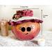 This is a fall apple decoration. It is a real gourd with a happy face  carved into it. This gourd is named Apple and  8x 8 inches.